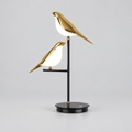 Goldie Birds Table Lamp on a clean plain studio background