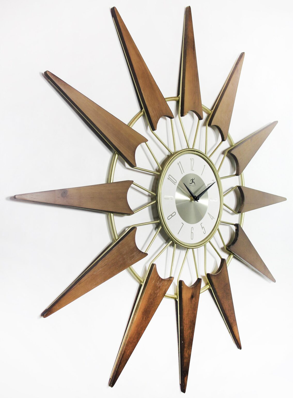 Nova starburst wall clock at an angle showing walnut-toned rays and brushed silver dial