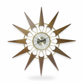 Nova starburst wall clock with aged wood rays, gold frame and silver face