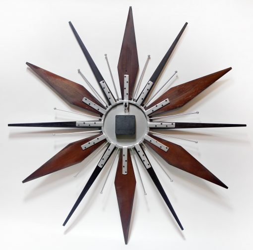 Back of the Utopia Satellite wall clock showing the rear mounting hardware and clock mechanism