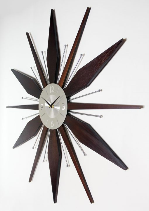 Utopia Satellite wall clock alternate front view with dark wood-tone rays and silver dial