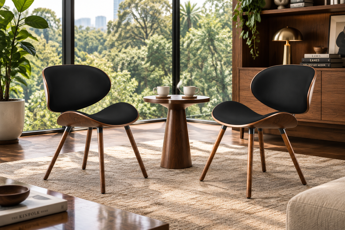 Two Marisal Accent Chairs facing each other with a side table and two coffee cups between them